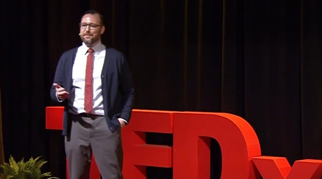 K Chad Clay giving a human rights Ted talk in Georgia.